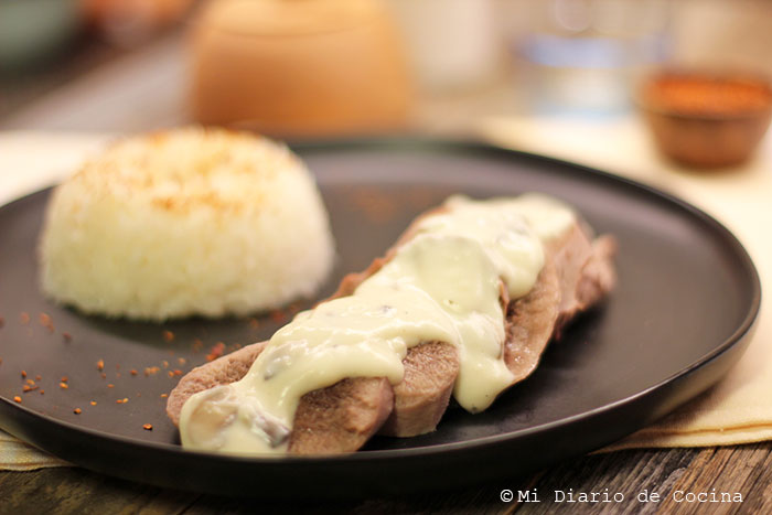 Beef tongue with white sauce and mushrooms