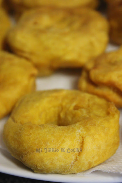 Picarones (pumpkin donuts) with panela sauce