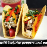 Tacos with beef, rice, peppers, and parsley